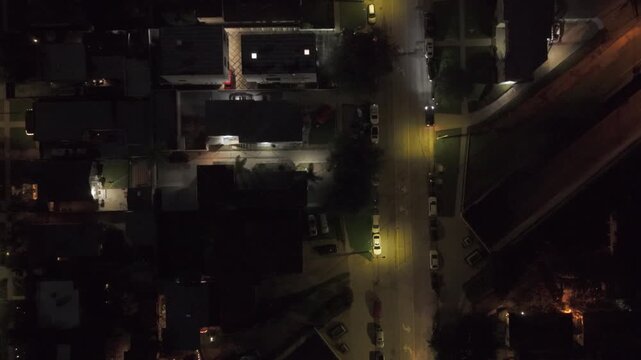 Aerial night shot flyover city streets
