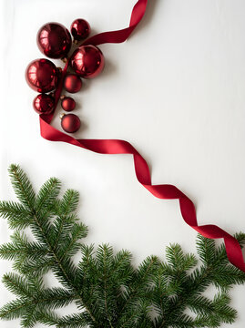 Elegant Christmas Background with Red Baubles and Green Fir Branches