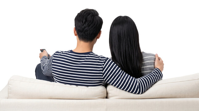Young asian couple watching television together sitting on cozy couch holding remote control on transparent background