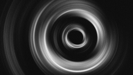 Fototapeta premium Abstract monochrome vortex vector. Grainy spiral light burst with radial halftone texture. Perfect cosmic space background, dynamic motion blur, and minimalist dark gradient aesthetic illustration.