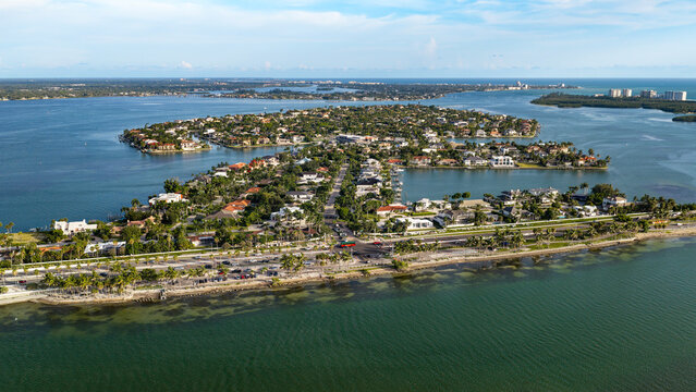 An aerial view of Bird Key, adjacent to downtown Sarasota, Lido Key, and Siesta Key. Bird Key Park is a public park along the coastline of Sarasota Bay and features access to the Ringling Bridge.