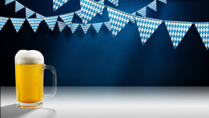 Fototapeta na wymiar Mug of foamy beer on a white surface and blue-and-white checkered pennants hanging against a dark blue wall. Perfect for Bavarian festival promotions and party invitations.