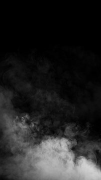 White smoke or vapor clouds rising against a solid black background, creating an atmospheric, mysterious, and dramatic texture effect ideal for overlay or design. Smoke background