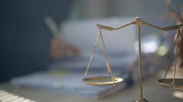 Justice scales displayed in front of a large stack of legal paperwork and files, representing complex cases, legal workload, document review, legislation, court records, compliance, and law practice.