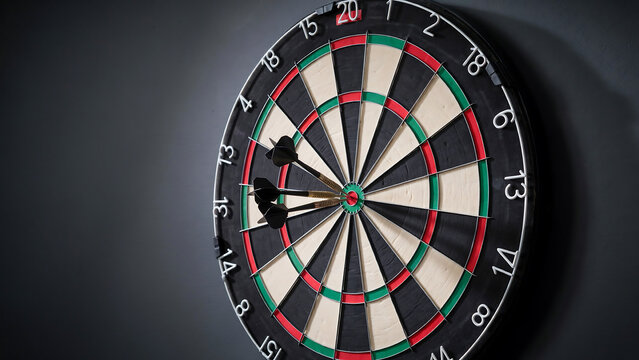 Close-up dartboard with darts stuck in black and gray target segments
