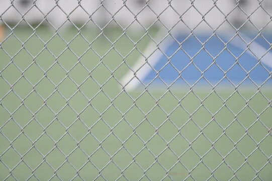 Chain Link Fence by a Tennis Court