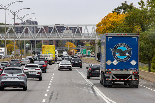 Quebec, Canada, 28 September 2026 : Vehicles and a Pratt and Whitney commercial truck navigate congested traffic on a highway