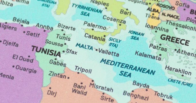Zoom out view of malta on a modern political world map