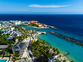 Fototapeta premium Mambo Beach with turquoise water, palm trees and white sand in Curacao, Caribbean