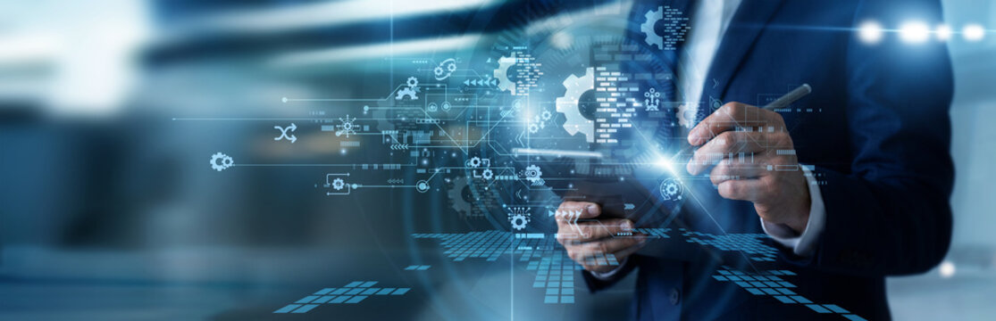 Change manager working on tablet guiding digital transformation strategies, redesigning legacy business workflows, deploying enterprise cloud systems, and monitoring organizational shifts.