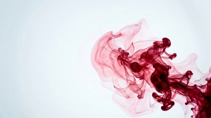 Fototapeta premium Abstract Red Ink Swirling in Clear Water on White Background