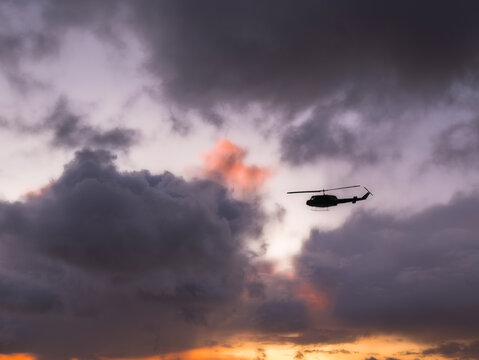 Bell UH-1 Iroquois Flying Into Sunset