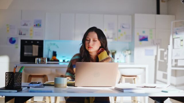 Freelancer drinking coffee laptop home office. Woman working remote startup.