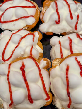 White Frosted Donuts with Red Strawberry Jam Drizzle at Mexican Bakery &ndash; Panaderia Sweet Dessert
