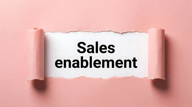 Sales enablement concept on torn pink paper with bold black typography banner