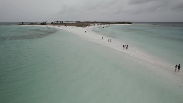 Aerial pull back view of Cayo de Agua sandbar and turquoise sea
