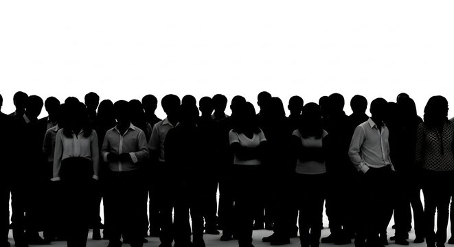 Silhouetted Crowd in Waiting: A large group of people stand together as dark silhouettes against a bright white background, their faces obscured.