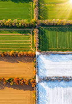 An aerial photograph showcases a patchwork landscape divided into four distinct quadrants, representing the seasons.