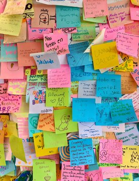 Panama City, Panama - September 29, 2026: Colorful handwritten sticky notes and personal messages covering a wall inside a local cafe in Panama City