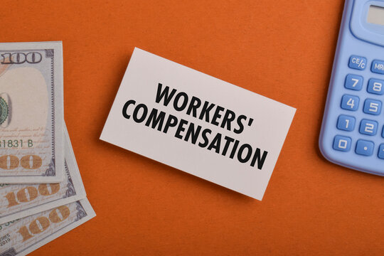 Workers' compensation concept featuring a claim card, money and calculator, representing workplace injuries, employee benefits, insurance claims, compensation, and financial recovery.