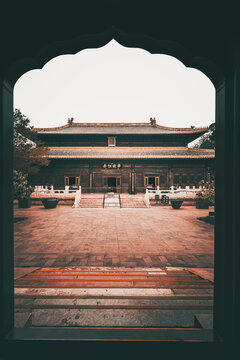 Imperial hall with a green-tiled roof framed by a gateway, Beijing, China