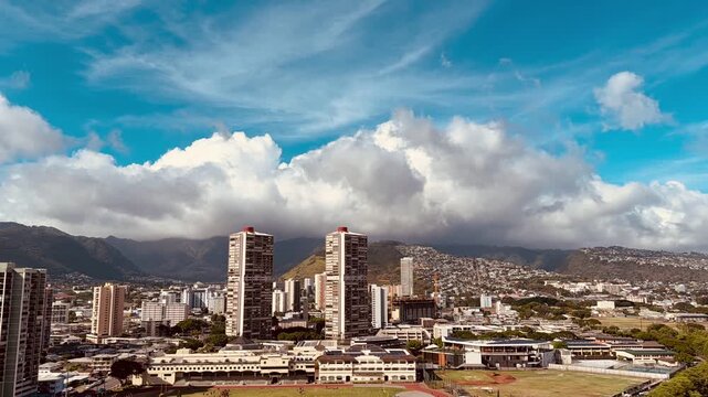 Time-lapse photography of cumulus and cirrus clouds. Waikiki, City of Honolulu, Oahu island, Hawaii. Koʻolau Range ( windward shield volcano). Trade winds