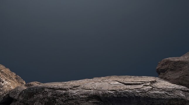 Rugged dark stone podium for product display set against gloomy moody mountain rocky environment.