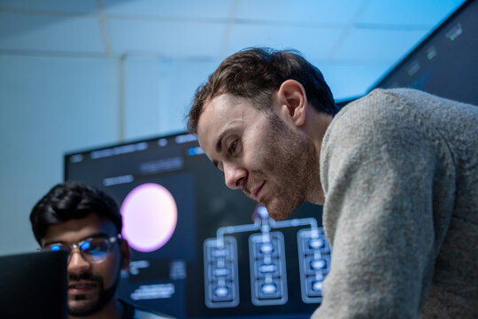 Software engineering use computer working develop AI office are assisting algorithm systems or verifying code. Programmer teamwork using artificial intelligence on laptop analysis or writing coding