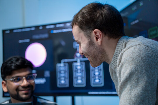 Software engineering use computer working develop AI office are assisting algorithm systems or verifying code. Programmer teamwork using artificial intelligence on laptop analysis or writing coding