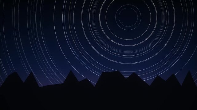 Star trails over silhouetted mountain range at night showing celestial rotation and the passage of time