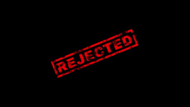 Red grunge rubber stamp with the word rejected on a black background