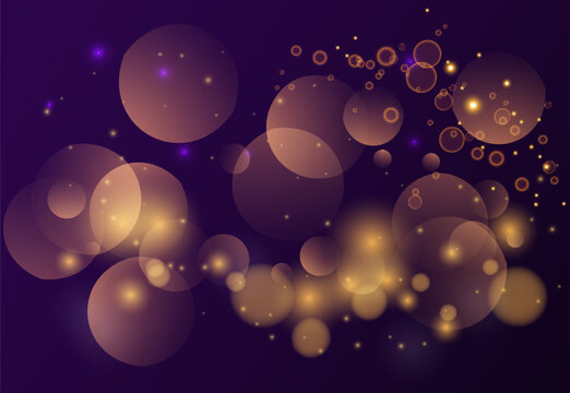 Abstract glowing golden bokeh lights on dark background with soft blurred circles and sparkling particles creating festive illumination.