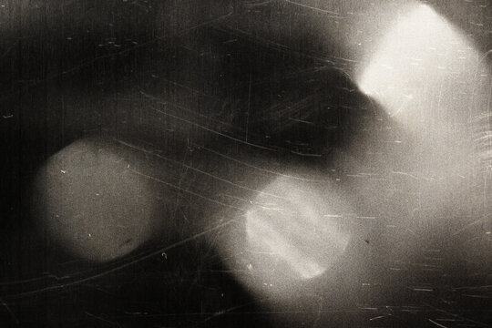 Old film texture with scratches, noise and light leaks. Realistic transparent overlay film texture in black-white, dust and grain. Distressed retro movie or photo negative effect of cinema nostalgia