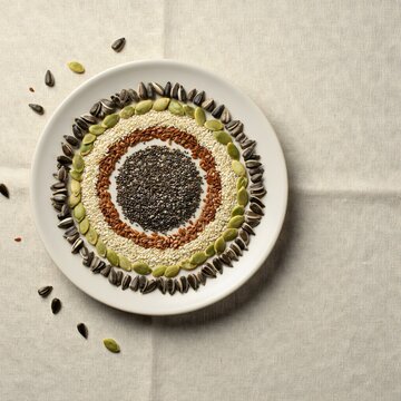 Healthy Seed Platter with Assorted Seeds Arranged in a Circular Pattern on Ceramic Plate
