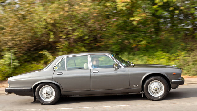 Milton Keynes; UK - Sept. 27th 2026: 1985 Jaguar Sovereign   classic car driving on a British road