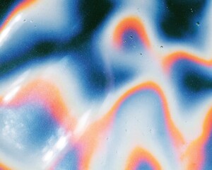 Fototapeta premium Holographic mirror glaze surface with a wet iridescent sheen and rainbow ripples for confectionery packaging and pop culture backgrounds