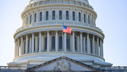 USA Flag near American Capitol dome. American flag, stars and stripes closeup. American flag in...