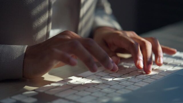 Close-up of hands typing quickly on a computer keyboard, representing digital office work, data entry, business communication, productivity, technology, and everyday professional tasks.