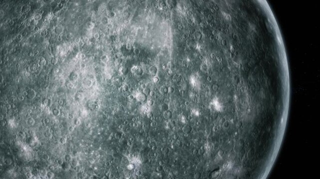 Close-up of the moon surface with craters and rough detail against black space