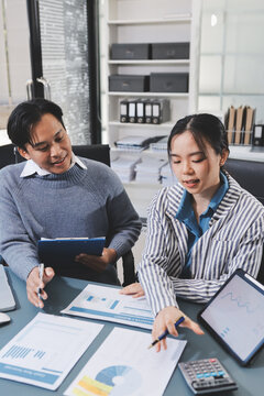 Business professional analyzing financial data on digital tablet dashboard with calculator and laptop, representing accounting software, ERP system integration, performance monitoring.