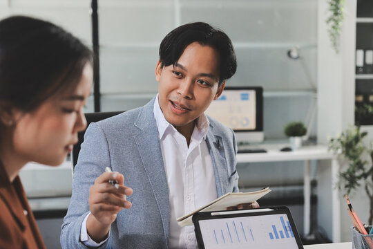 Business professional analyzing financial data on digital tablet dashboard with calculator and laptop, representing accounting software, ERP system integration, performance monitoring.