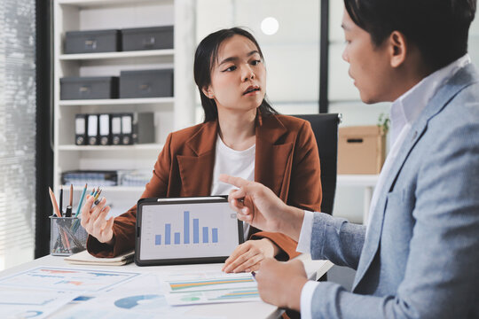Business professional analyzing financial data on digital tablet dashboard with calculator and laptop, representing accounting software, ERP system integration, performance monitoring.