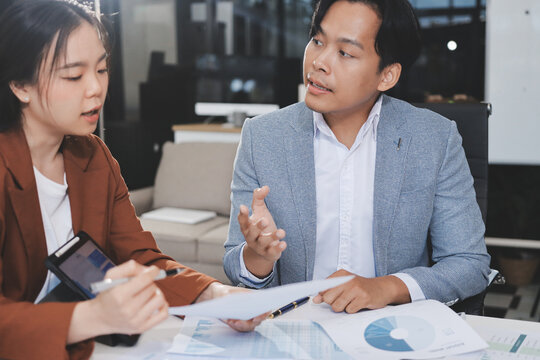 Business professional analyzing financial data on digital tablet dashboard with calculator and laptop, representing accounting software, ERP system integration, performance monitoring.