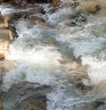 Canada, Alberta, Banff National Park.   Surging water of the Johnston Creek in the Johnston Canyon, a popular hike for park visitors.