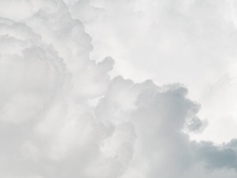 Soft gray overcast storm clouds filling sky, moody minimal weather background with gentle diffused light and copy space