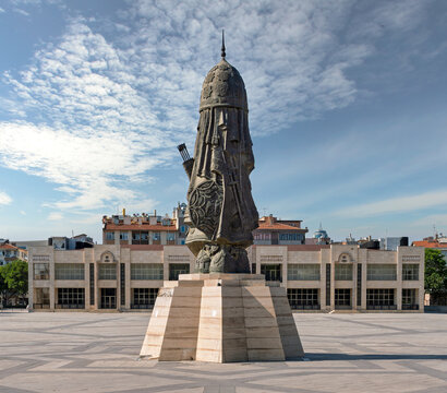 Konya, Turkey - June 7, 2025: Kilicarslan Statue in the foreground at Kilicarslan City Square with Payitaht Muzesi Museum in the background under a partly cloudy sky