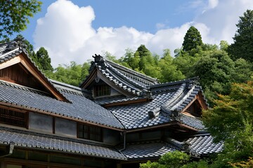 Fototapeta premium 古民家の瓦屋根と青空広がる森の日本の風景