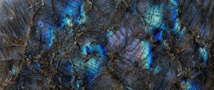 Labradorite stone slab with iridescent blue and purple mineral veins and dark grey texture