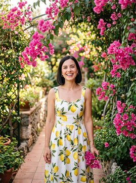 Woman smiling on a garden path beneath pink bougainvillea. Portrait surrounded by flowering vines and greenery. Summer fashion and botanical beauty. Outdoor lifestyle and personal style.