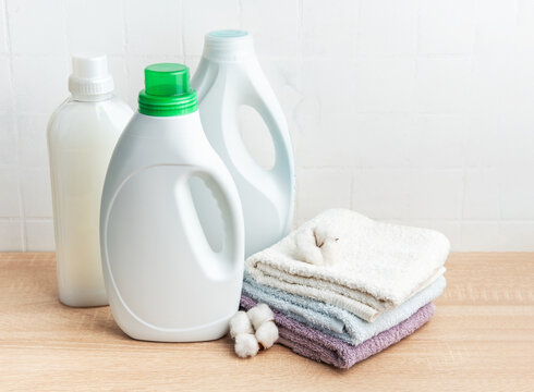 Laundry detergent bottles and cotton towels for household cleaning